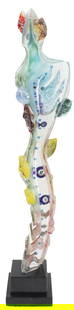 Susan Gott (Born 1959) American, Surrealist Art Glass Sculpture: Susan Gott (Born 1959) American, Surrealist Art Glass Sculpture. Stylized feminine figure with an elongated body twisting upward. Clear glass with colorful elements including shells, faces, leaves, an