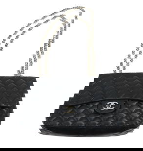 Chanel Calfskin/Lambskin Leather Bag: Chanel Calfskin/Lambskin Leather Bag. Single flap. Silver toned chain, adjustable. Exterior pocket. Name on interior. Interior pocket and interior zippered pocket. Comes with Chanel storage bag.