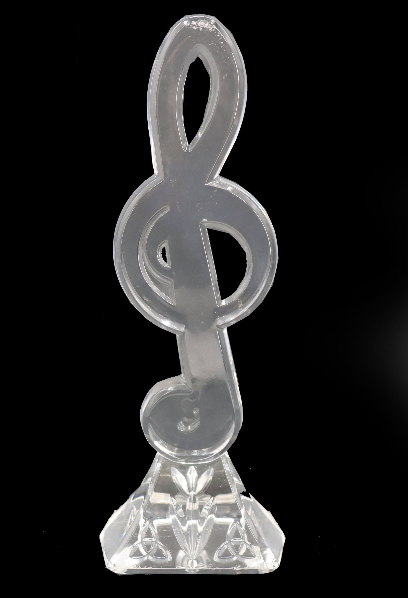 Waterford Crystal Clef Note Paperweight: Waterford Crystal Clef Note Paperweight. Waterford Crystal glass paperweight in the shape of a translucent clef note on square stepped base. Waterford refers to the renowned crystal and glassware comp