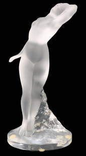 Lalique France Glass Crystal Female Dancer, Dans Beige: Lalique France Glass Crystal Female Dancer, Dans Beige. Lalique crystal figurine of a dancing nude woman. Sticker on base. Lalique glass refers to the exquisite glasswork created by French artist and
