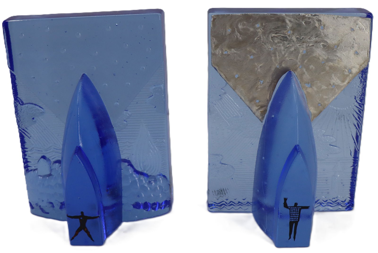 Bertil Vallien (1938-2018) Kosta Boda Blues Four Elements Sculpture: Bertil Vallien (1938-2018) Kosta Boda Blues Four Elements Sculpture. Blue sculpture with a oblong triangle in the middle and a man inside it. Outside the triangle is a landscape showing the elements.&