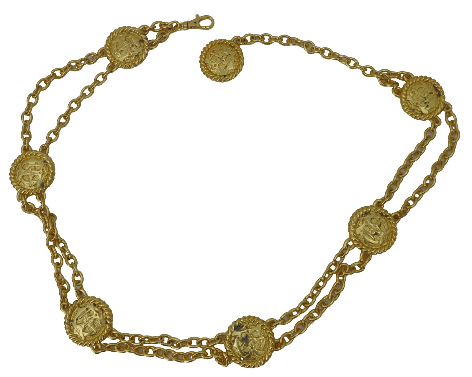 Double Chain Gold Toned Metal Belt: Double Chain Gold Toned Metal Belt. Interspersed along the chains are several circular medallions. The belt has a hook closure and an adjustable chain section with a smaller, single medalli