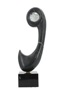 Abstract Black Marble and Art Glass Statue: Abstract Black Marble and Art Glass Statue. Abstract sculpture of polished black marble with white veins, with spiraling green art glass oval inset in top. Attached by heavy screw to black base. Unsig