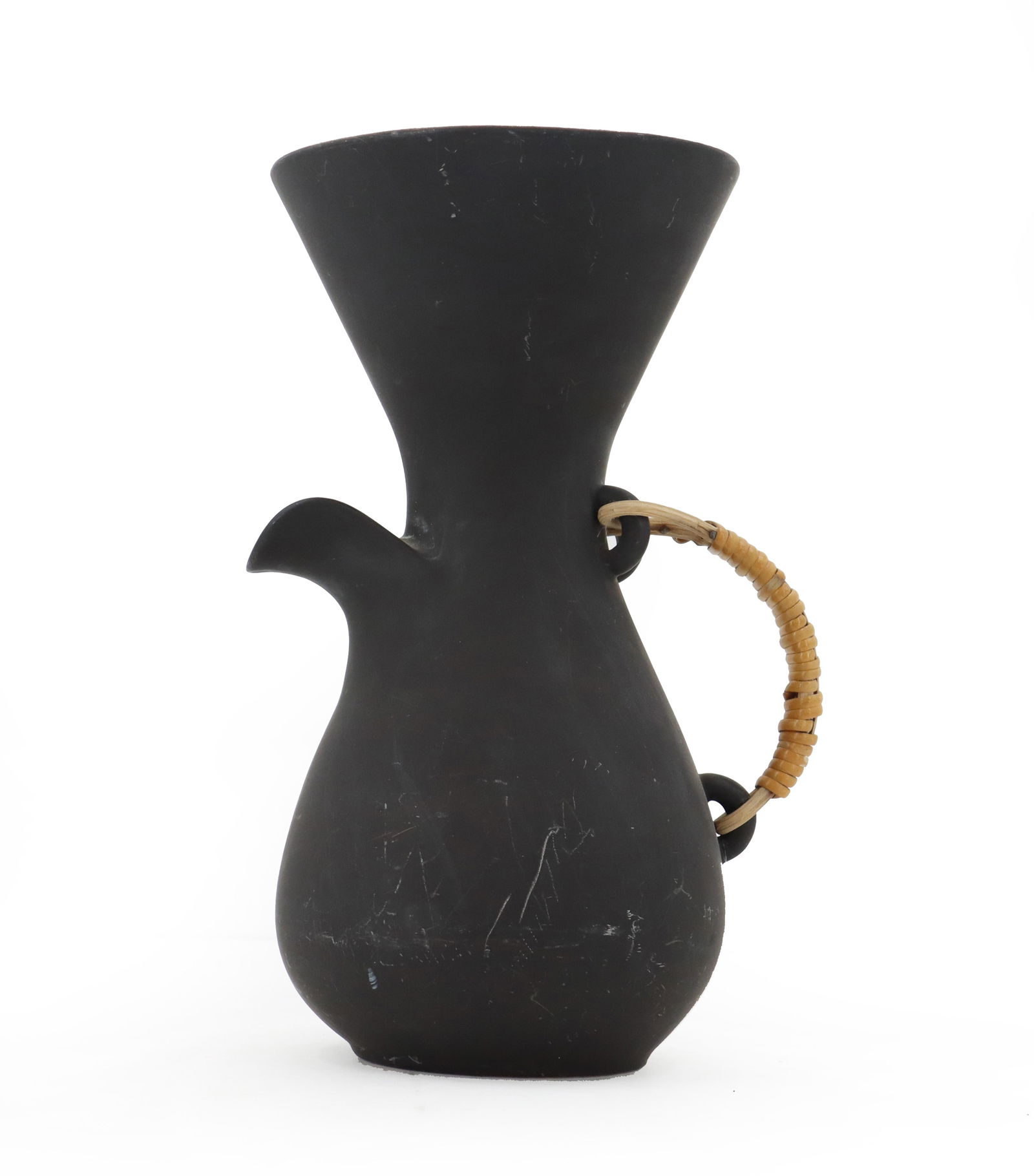 Kenji Fujita Pottery Pitcher: Kenji Fujita Pottery Pitcher. Marked on bottom. Crafted from dark matte-glazed pottery. Bulbous at base, tapering inward towards a narrower neck, and then flaring out into a wide, conical top. H