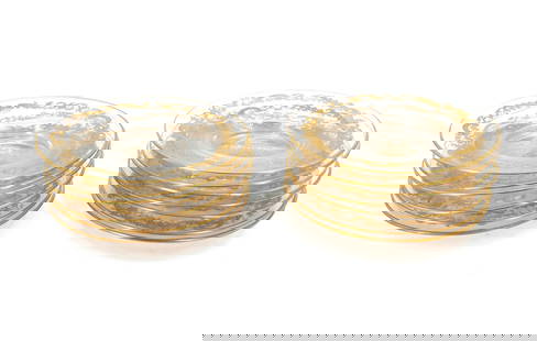 (13) Gold Gilt Glass Bread and Butter Plates with S Insignia: (13) Gold Gilt Glass Bread and Butter Plates with S Insignia. Delicate patterns surround the ornate S in the middle, with a gilt rim as well.&nbsp; Condition: Rubbing on each piece. Overall good.&nbsp