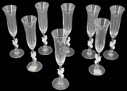 (8) Gorham Amore Dove Crystal Champagne Flutes: (8) Gorham Amore Dove Crystal Champagne Flutes. Each flute has a frosted crystal dove with wings outstretched surrounding the stem. Two pieces have original tag on the bottom which gives price, name,