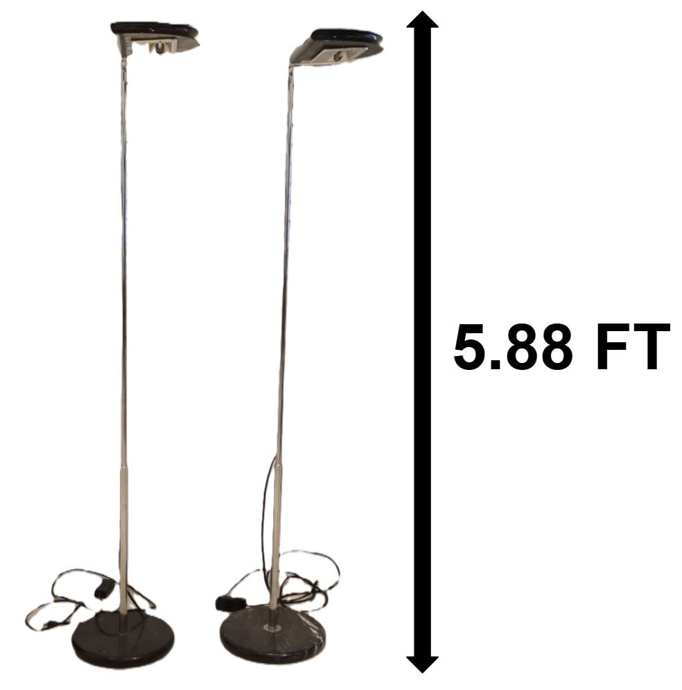 Bruno Gecchelin (Born 1939) Italian, (2) "Mezzaluna" Floor Lamps:  Bruno Gecchelin (Born 1939) Italian, (2) "Mezzaluna" Floor Lamps. Chromed metal, marble, and plastic. Tall modern floor lamps with sleek lamp heads and flat black bases. Sticker o
