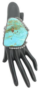 Native American Sterling Silver & Turquoise Cuff - Gross 4.770 ozt.: Native American Sterling Silver &amp; Turquoise Cuff. Marked on inside.&nbsp; Marked H H on inside. Large irregular shaped turquoise set in sterling silver. Braided rope border with small flower motif