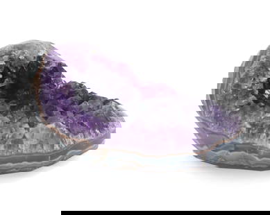 Heart-Shaped Museum Quality Amethyst Geode: Heart-Shaped Museum Quality Amethyst Geode. Stunning deep purple center lightening to the edges, with lovely chalcedony visible along the sides leading to the rough stone back.&nbsp; Condition: Commen