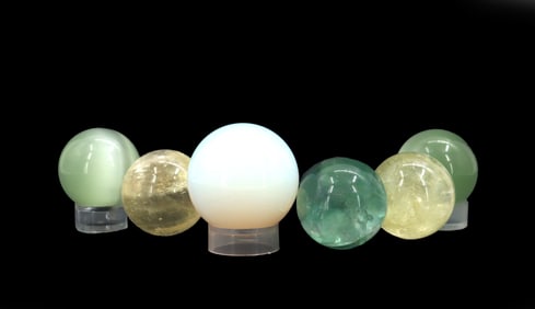 A Variety of 6 Spheres of Varying Opacity and Shades of Green