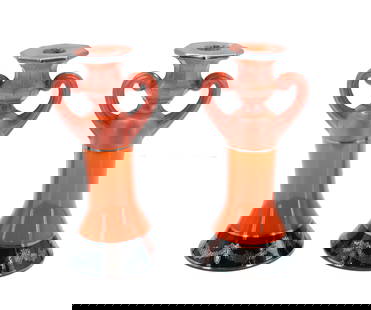(2) Art Deco Style Glass and Enamel Painted Sculptural Vases or Candlesticks: (2) Art Deco Style Glass and Enamel Painted Sculptural Vases or Candlesticks. Overall orange body, and a black band with silver wreath patterns around it is at the edge of what could be the