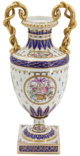 Late 19th Early 20th Century Sevres Style Porcelain and Gilt Bronze Vase Urn: Late 19th Early 20th Century Sevres Style Porcelain and Gilt Bronze Vase Urn. Appears to be marked sevres on the underside but we are saying style to be safe. Fantastic gilt entwined handles in the fo