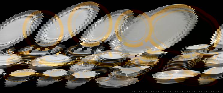 (65) French CH Field Haviland Limoges Double Gold Encrusted Dinner Service: This exquisite porcelain dinnerware set by CH. Field Haviland Limoges exemplifies the elegance and refined craftsmanship of fine French tableware. The design features a brilliant double gold encrusted