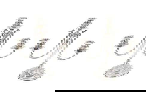 (2) European Weighted .800 Silver Candelabras: (2) Weighted Silver Candelabras. Matched pair of weighted silver candlesticks with two elegant, low-scoop arms, three sconces each. On broad circular foot, impressed hallmarks on exterior rim. Silver