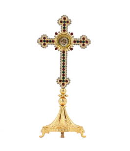 Antique Brass Jeweled Reliquary of the True Cross: Antique Brass Jeweled Reliquary of the True Cross. Ornate brass altar cross decorated with inlaid imitation precious stones and rhinestones on foliate pedestal with three feet. Circular compartment at