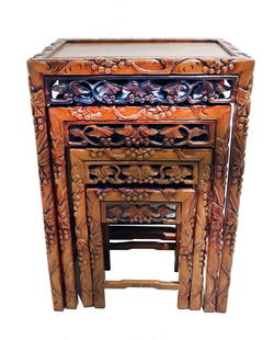 (4) Chinese Elaborately Carved Wood Nesting Tables: (4) Chinese Elaborately Carved Wood Nesting Tables. Group of four Chinese carved wood nesting tables, with detailed carvings of fruiting grape vines&nbsp;along apron and down legs. Chinese nesting tab