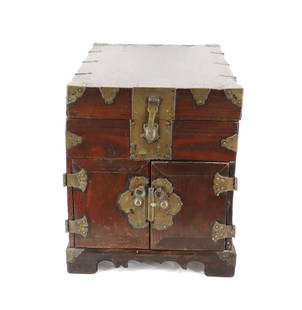 Korean Chest With Elaborate Brass Mounts: Korean Chest With Elaborate Brass Mounts. Top opens for a narrow large storage area for necklaces or other smaller items. Two small and one larger bottom drawer pull out from the bottom for deepe