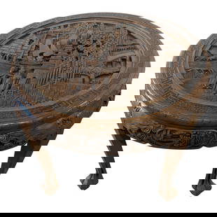 Round Chinese Coffee Table with  Carved Coastal Scene: Overall Size: 29 1/2 x 29 1/2 x 21 1/2 Round Chinese Coffee Table with &nbsp;Carved Coastal Scene. Image depicts two figures standing below a tower / castle along the water. As a large ship sits withi