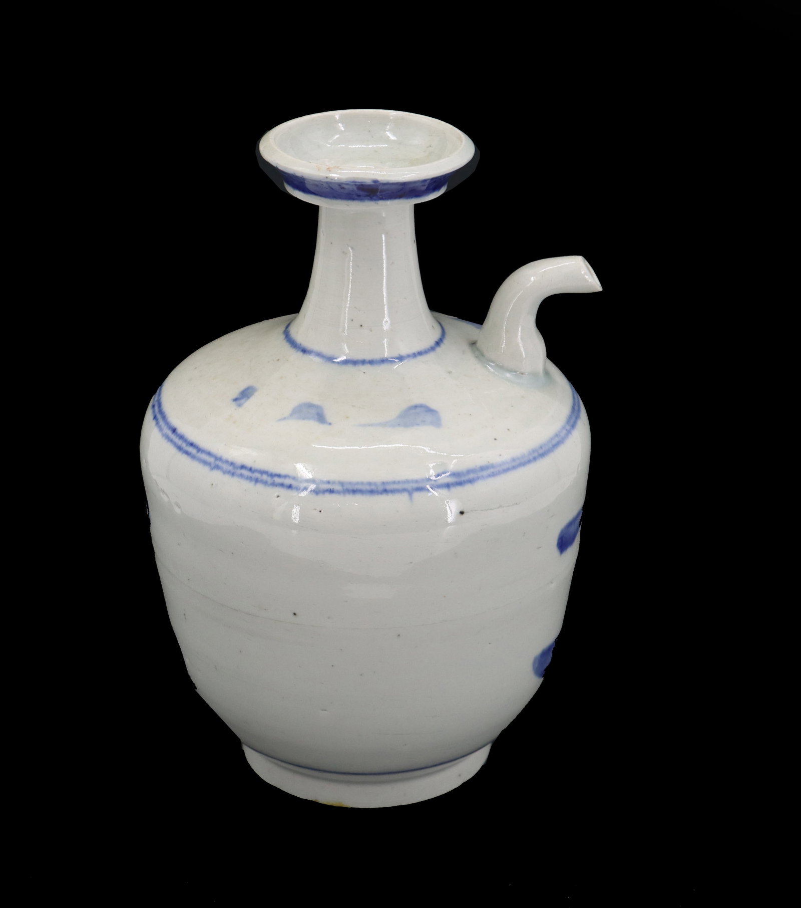 Antique Chinese Porcelain Spouted Ewer: Antique Chinese Porcelain Spouted Ewer. Hand painted porcelain ewer with white glaze ground and cobalt foliage decoration and rim accents. Ewers are elegant, often elaborately decorated vessels tradit
