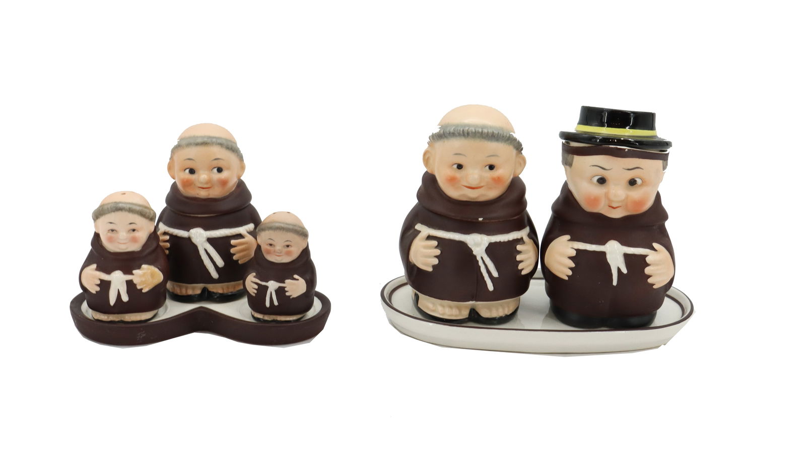 (2) Sets of Porcelain Goebel Hummel Monks Serveware Figurines: (2) Sets of Porcelain Goebel Hummel Monks Serveware Figurines. One set of three, with a salt and pepper shaker and a cream dispenser, and the other a set of two for cream and sugar. Marked on the