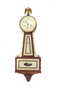 Seth Thomas Banjo Clock with Key & Pendulum: Seth Thomas Banjo Clock with Key &amp; Pendulum. Wall mounted banjo clock with eagle finial. Includes winding key and pendulum. Size: 30 x 9 1/2 x 4 in. &nbsp; Seth Thomas banjo clocks are iconic Amer