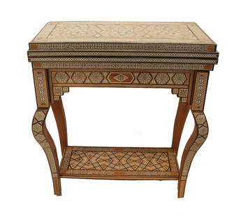 Moorish-Style Inlaid Folding Gaming Table: Syrian or Moorish Inlaid Folding Gaming TableThis intricately crafted table is a fine example of Syrian, Moorish, or Middle Eastern furniture design, showcasing a rich tradition of geometric marquetry