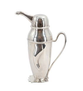 Stainless Steel Penguin Cocktail Shaker: Stainless Steel Penguin Cocktail Shaker. Stainless steel cocktail shaker with spout int he shape of a penguin. Made in India. Cocktail shakers are iconic barware essentials that blend function with fl