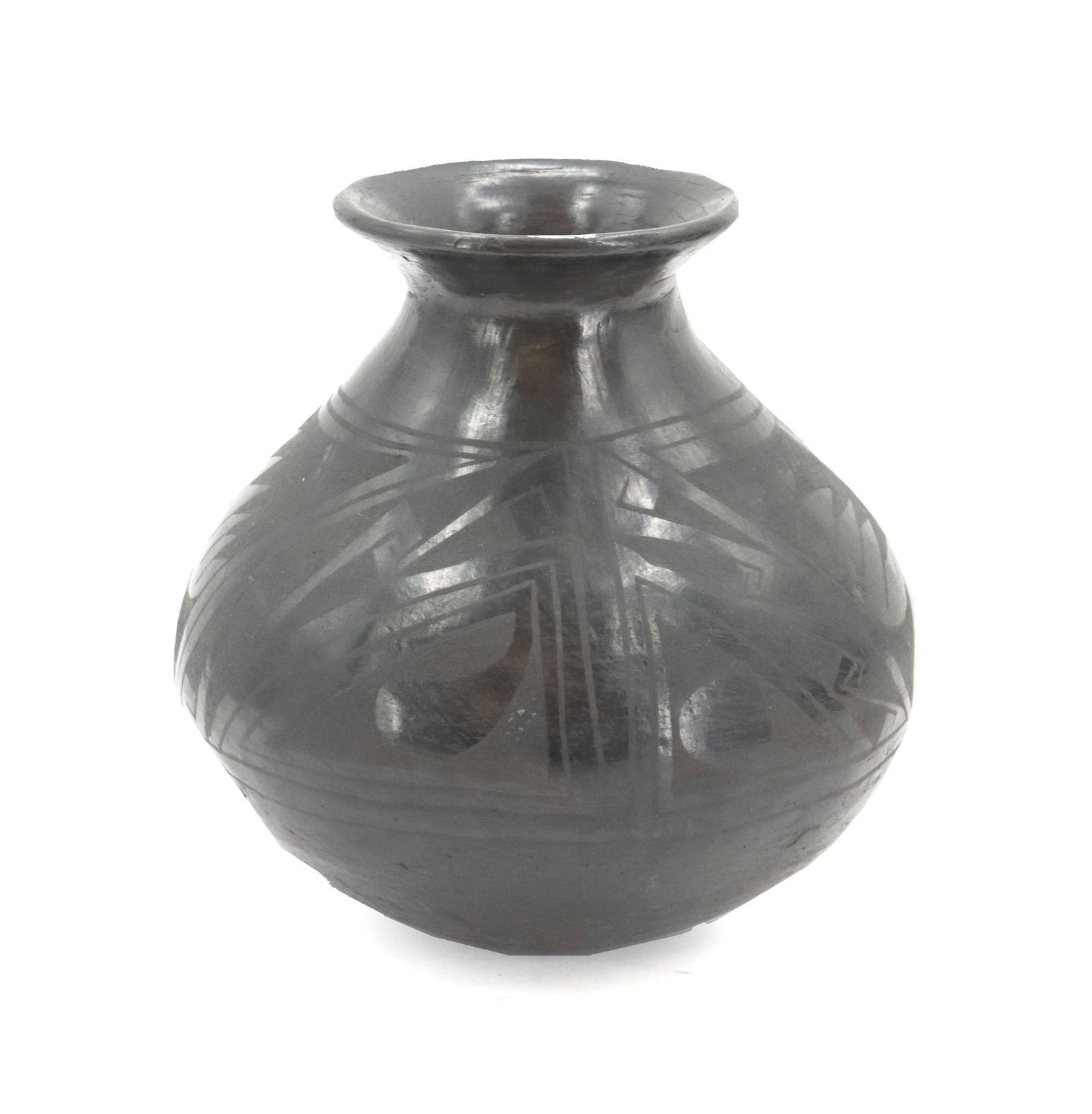 Mexican Oaxacan Polished Black Clay Vase: Mexican Oaxacan Polished Black Clay Vase. Classic shape with flared small mouth and a rounded base. Signed "GST" on the bottom. Condition: Very good. Size: 7 x 7 1/2 in. Ba