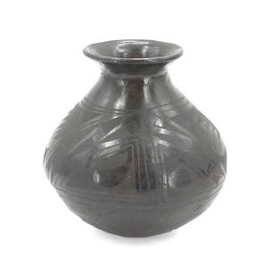 Mexican Oaxacan Polished Black Clay Vase: Mexican Oaxacan Polished Black Clay Vase. Classic shape with flared small mouth and a rounded base. Signed &quot;GST&quot; on the bottom.&nbsp; Condition: Very good.&nbsp; Size: 7 x 7 1/2 in.&nbsp; Ba