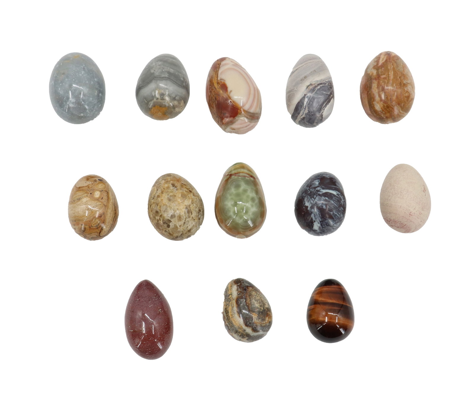 (13) Polished Stone Eggs: (13) Polished Stone Eggs. Each egg is distinct, showcasing the natural variations in color, veining, and texture of different types of stone. The eggs are smooth and polished, reflecting light a