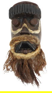 African Carved Wood Face Mask: African Carved Wood Face Mask. Carved painted wood face mask decorated with fur and jute. African wooden masks are powerful cultural artifacts that hold deep spiritual and ceremonial significance acro
