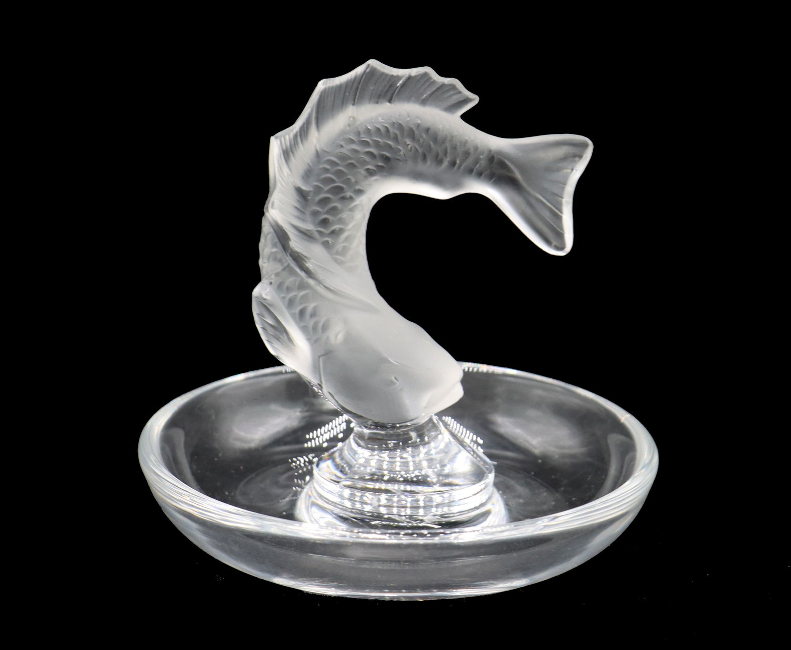 French Lalique Flying Fish Trinket Dish: French Lalique Flying Fish Trinket Dish. French Lalique glass sculptural trinket dish in flying fish form. Incise signature on base, Lalique France. Size: 3 3/4 x 3 3/4 x 3 3/4 in. Lalique is a French