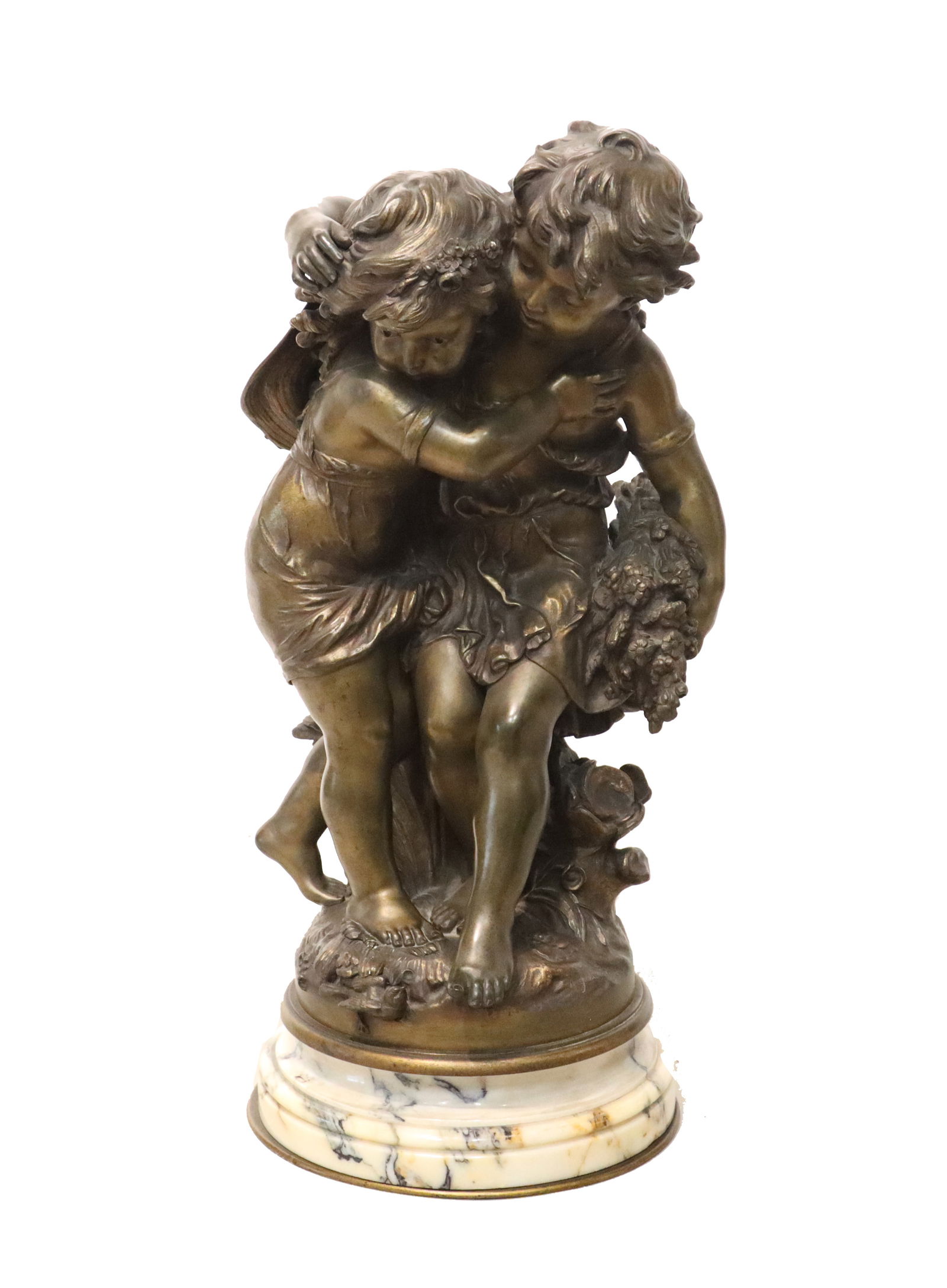 After Auguste Moreau (1834-1917) French, Bronze Sculpture with Marble Base: After Auguste Moreau (1834-1917) French, Bronze Sculpture with Marble Base. Base is detachable, bears a label from an art seller in Lyon, France. Depicts two young peasant boys carrying flowers and hu