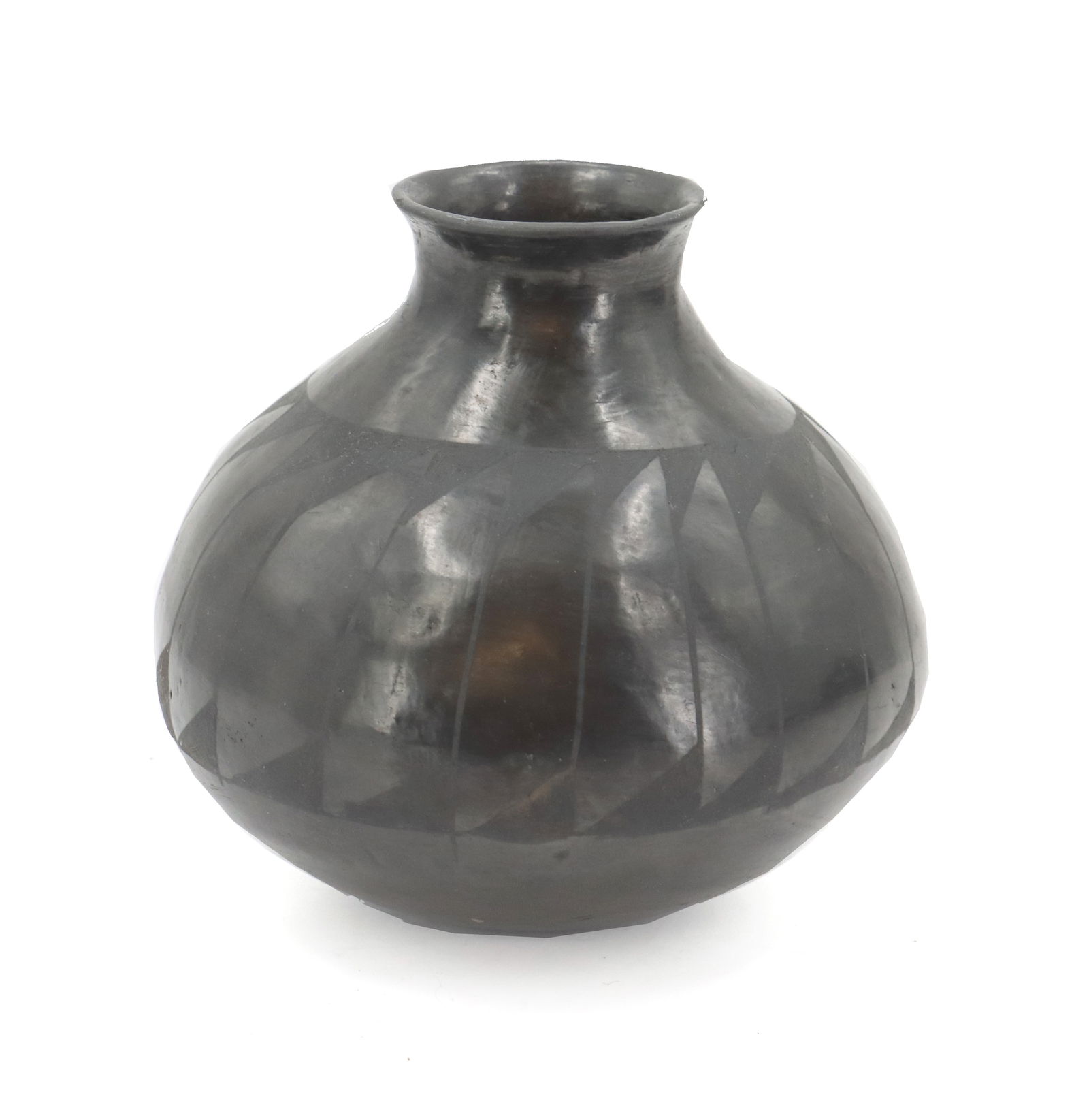 Mexican Oaxacan Polished Blackware Clay Vase: Mexican Oaxacan Polished Blackware Clay Vase. Classic shape with flared small mouth and a rounded base. Signed "GST" on the bottom. Condition: Minor apologies. Size: 7 x 7 i