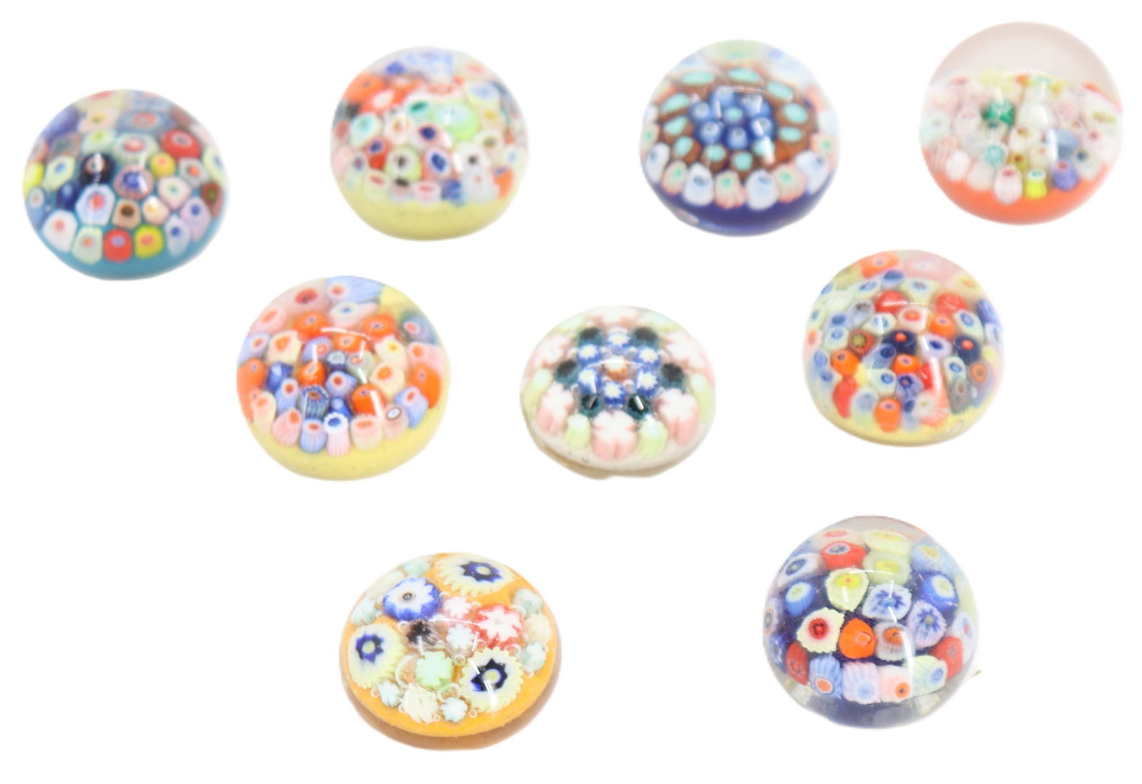 (9) Millefiori Art Glass Paperweights: (9) Millefiori Art Glass Paperweights. A variety of shapes and colors, some with labels affixed to the bottoms with prior pricing and identification numbers. Largest Size: 1 3/4 x 1 1/8 in.