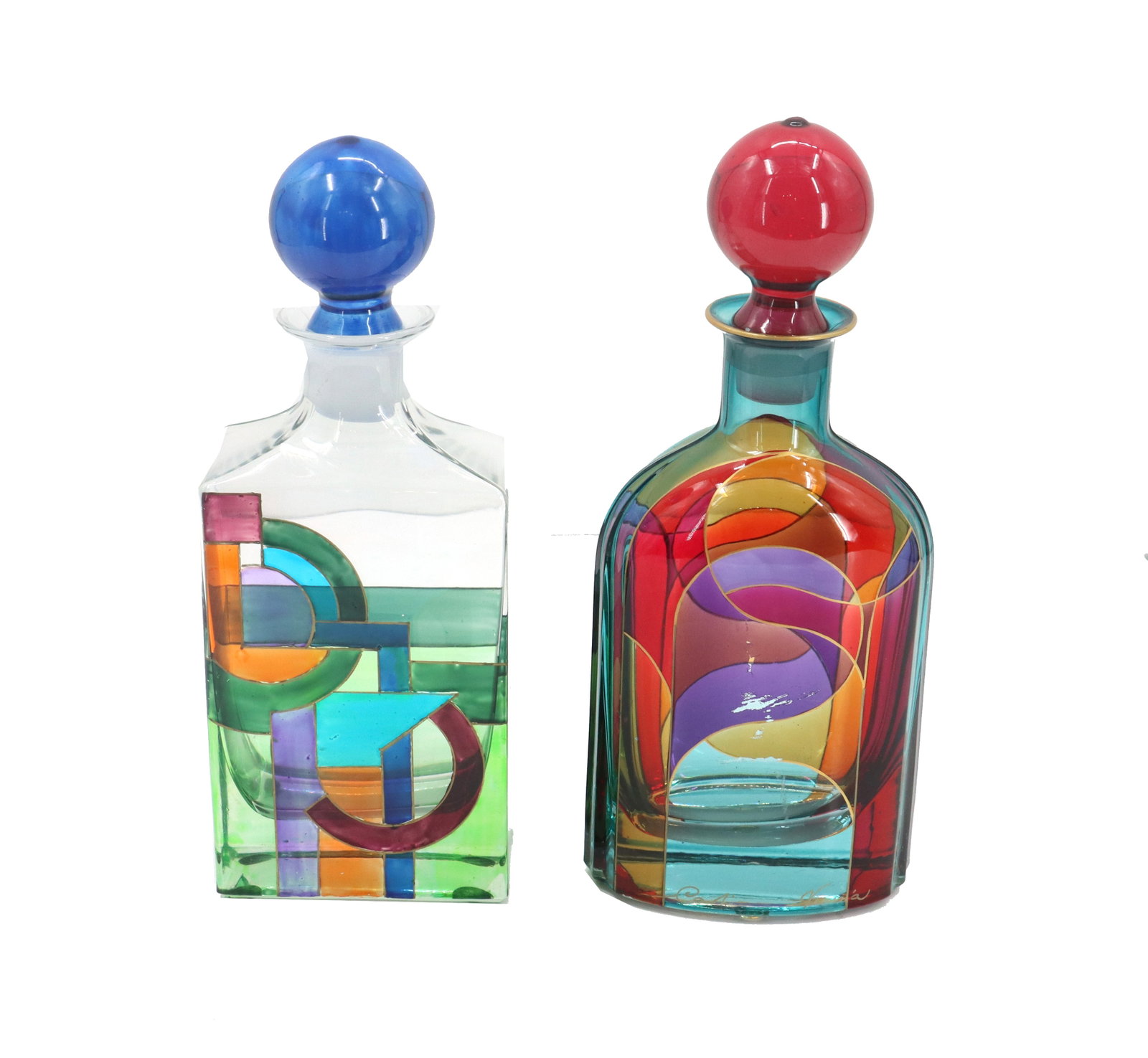 (2) Venetian Psychedelic Mid Century Murano Art Glass Decanters: (2) Venetian Psychedelic Mid Century Murano Art Glass Decanters. One with more geometric patterns, the other more fluid in design and signed "Caroli Venezia" at the bottom edge. Condit