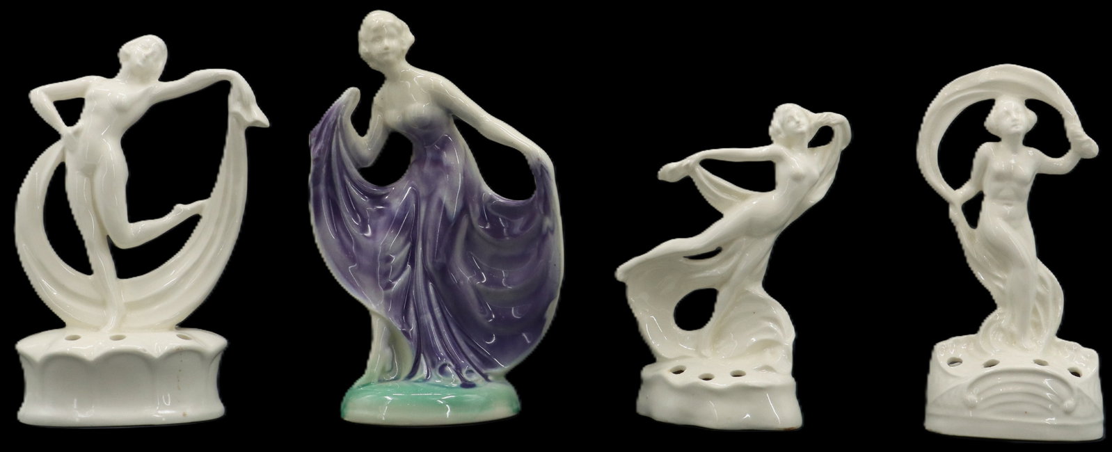 (4) German Flower Arrangement Porcelain Female Figures: (4) German Flower Arrangement Porcelain Female Figures. One is painted, the others are pure white. Each has holes in the bases for flowers to grow through. Marked with origin on undersides. Cond