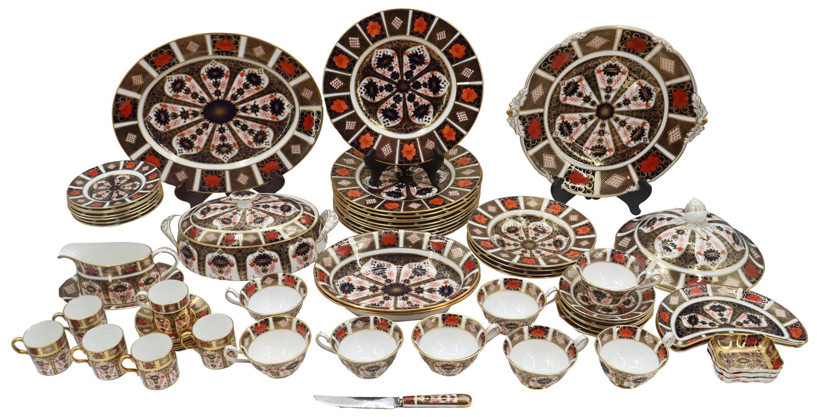 (63) Pieces of Royal Crown Derby China: (63) Pieces of Royal Crown Derby China. Marked on underside. Imari pattern. Includes 2 plates, 1 lid, 11 dinner plates, 7 small plates, 2 oval bowls, 4 circle bowls, 1 oval covered dish, 1 gravy boat