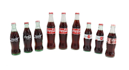 (9) Vintage McDonalds International Sealed Glass Coca-Cola Bottles