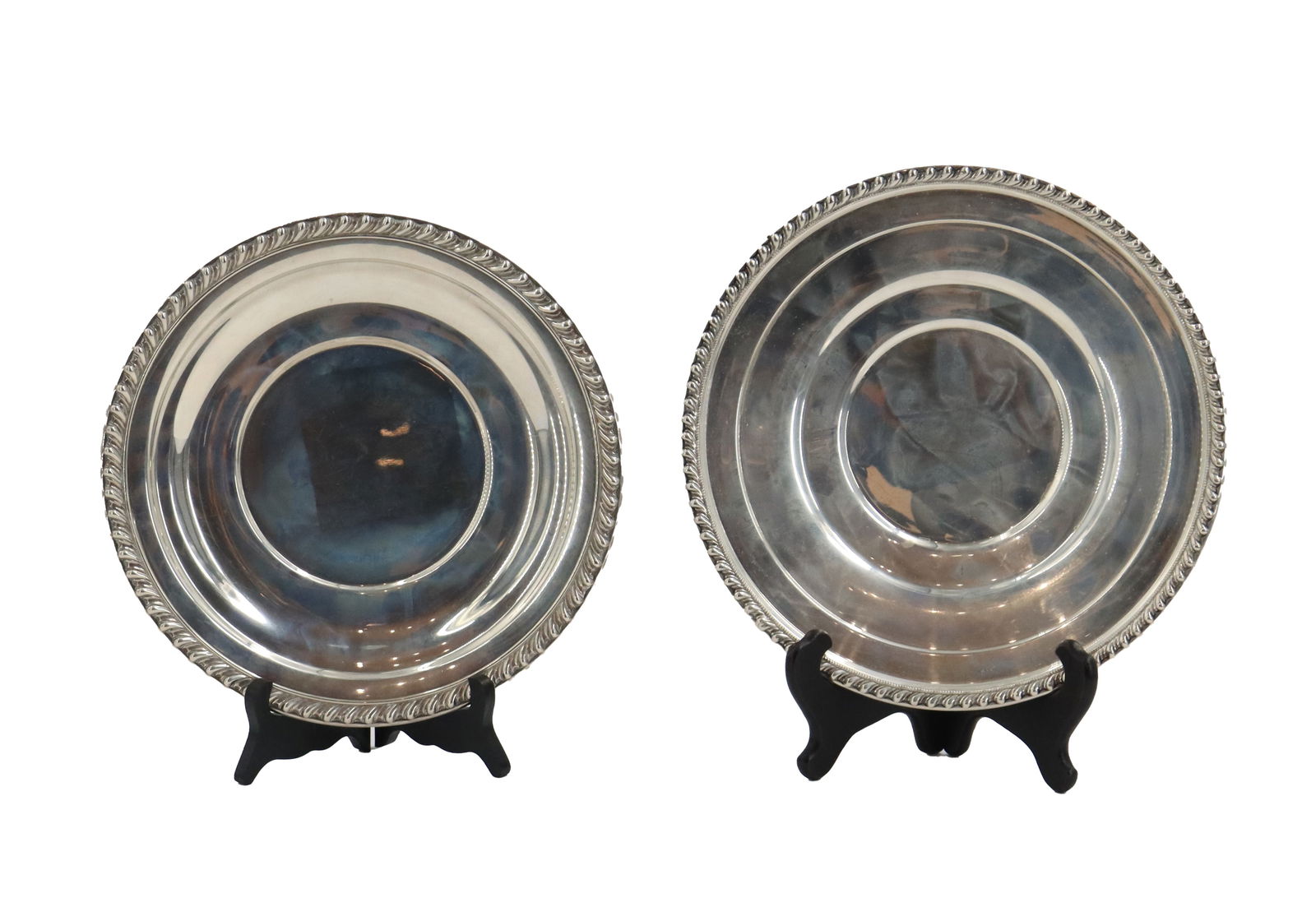(2) Wallace Sterling Silver Plates - 17.12 ozt.: (2) Wallace Sterling Silver Plates - 17.12 ozt. Marked on undersides. Size: 1 x 11 in. Weight: 17.12 ozt. In 1855 Robert Wallace (1815-1892), the son of Scot
