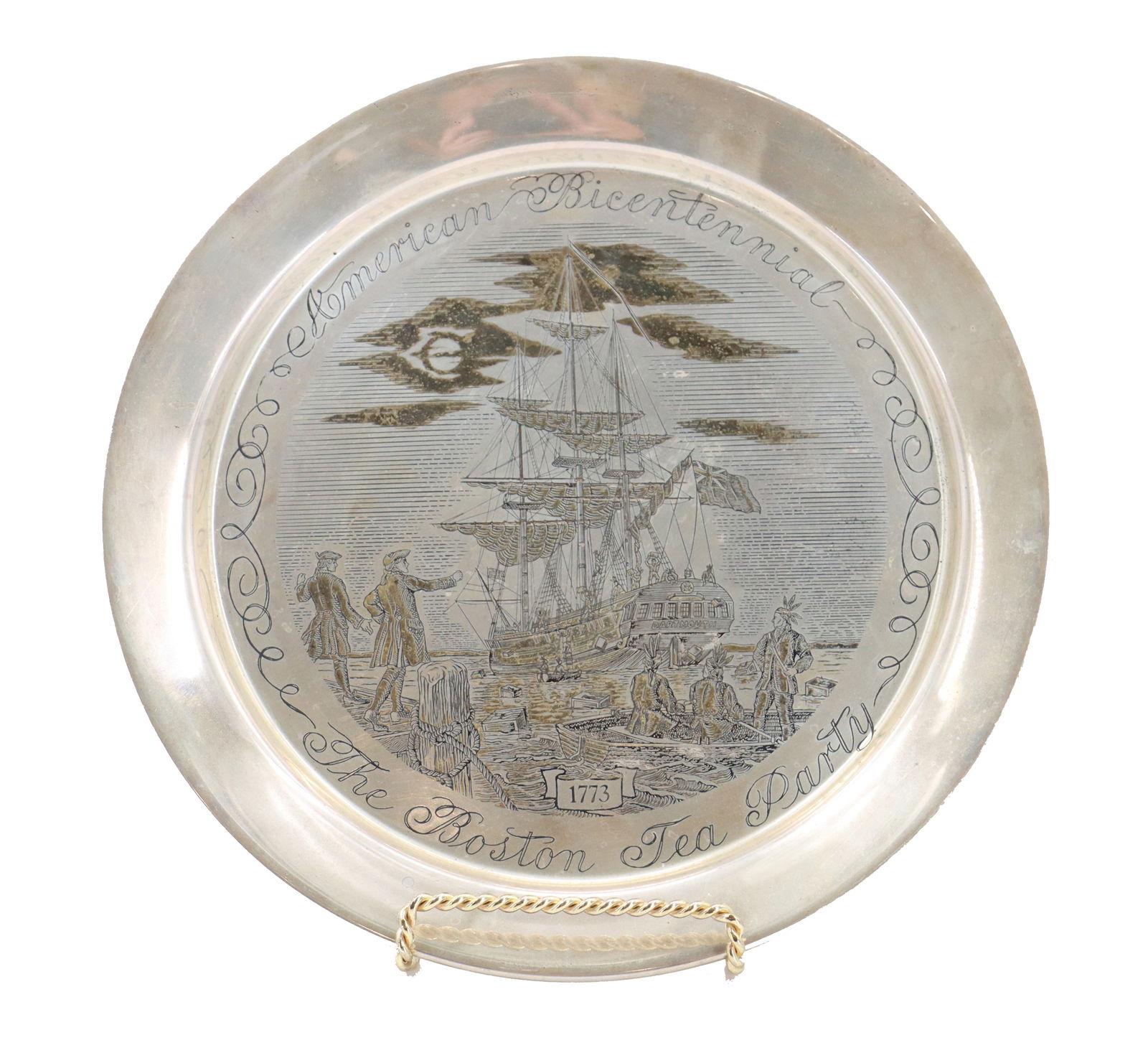 Danbury Mint 24K Gold and Sterling Silver "The Boston Tea Party" Etched Commemorative Plate - Gross: Danbury Mint 24K Gold and Sterling Silver "The Boston Tea Party" Etched Commemorative Plate - 7.600 ozt. Numbered 7198/7500. Size: 1/2 x 8 in.Gross Weight: 7.600 ozt. The Danbury Mint &