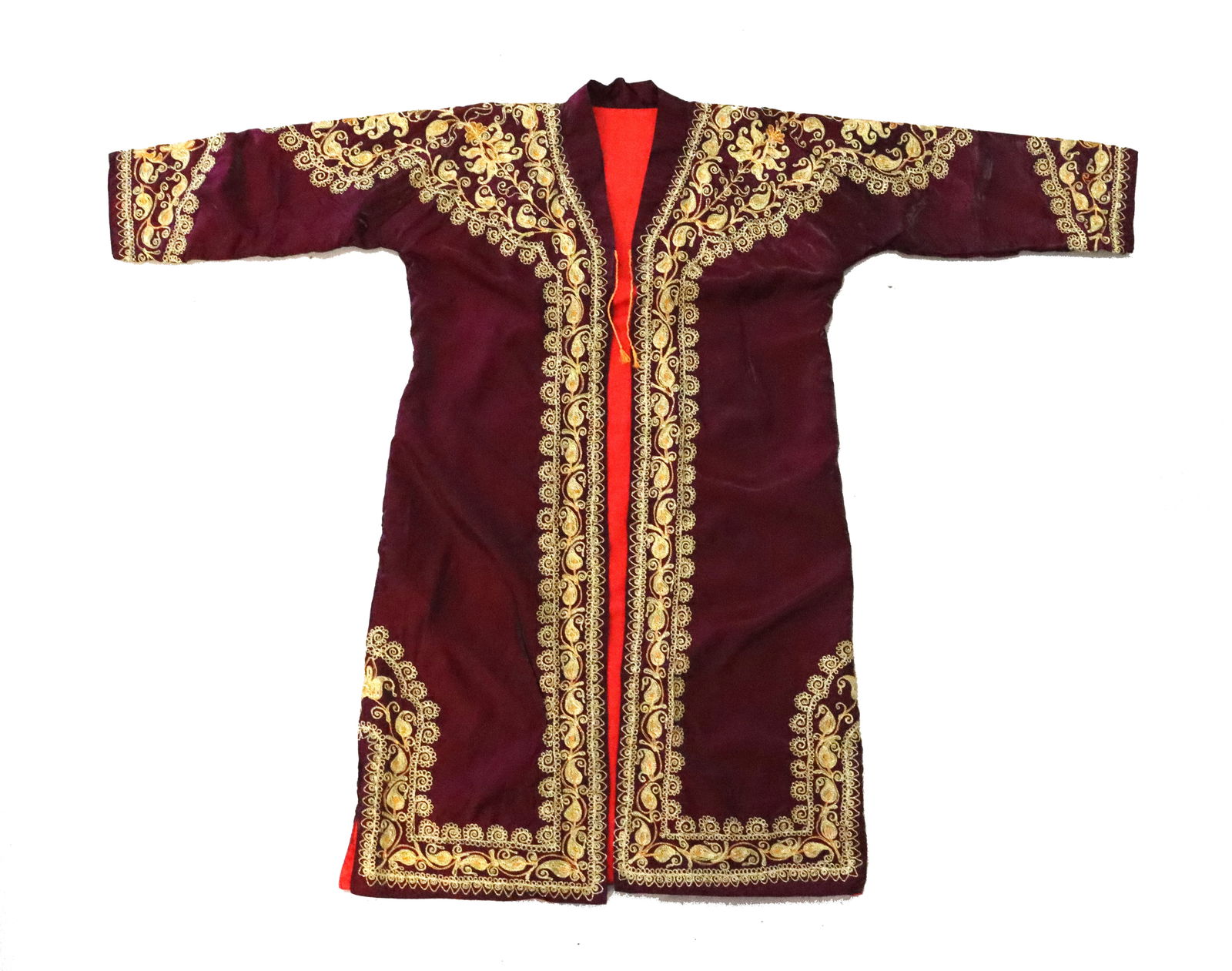 Bukharan Ceremonial Velvet Kaftan: Bukharan Ceremonial Velvet Kaftan. The open-front burgundy silk garment with an interior red silk lining that appears. The gold embroidery forms dense, stylized floral and paisley motifs, particu