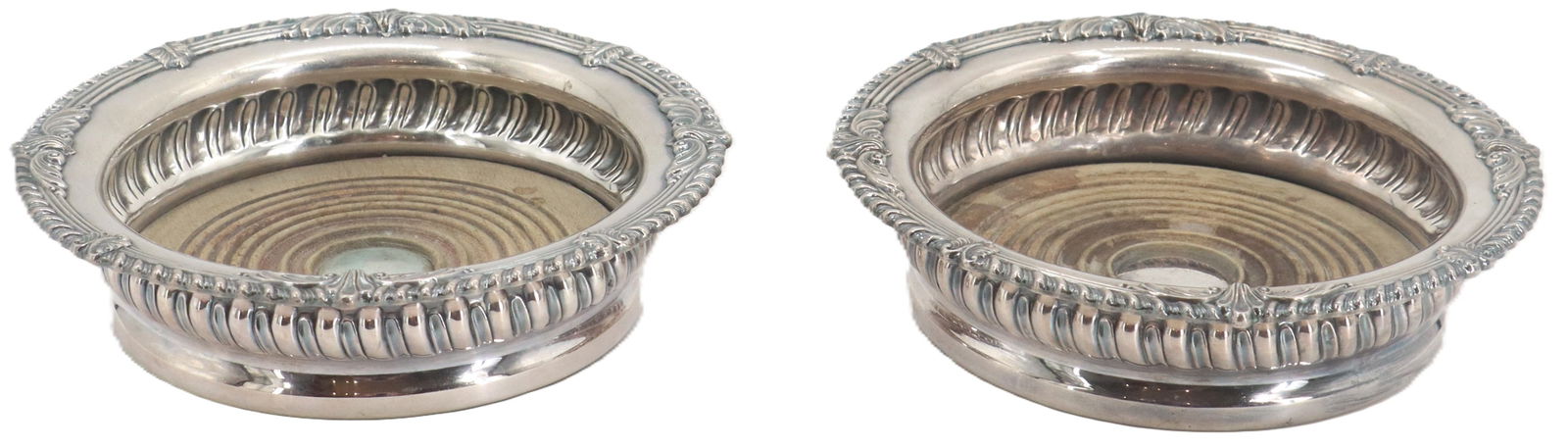 (2) Sheffield Silver Plated Wine Coasters: (2) Sheffield Silver Plated Wine Coasters. Pair of silver plated wine coasters. Size: 6 3/4 x 6 3/4 x 1 1/2 in. 