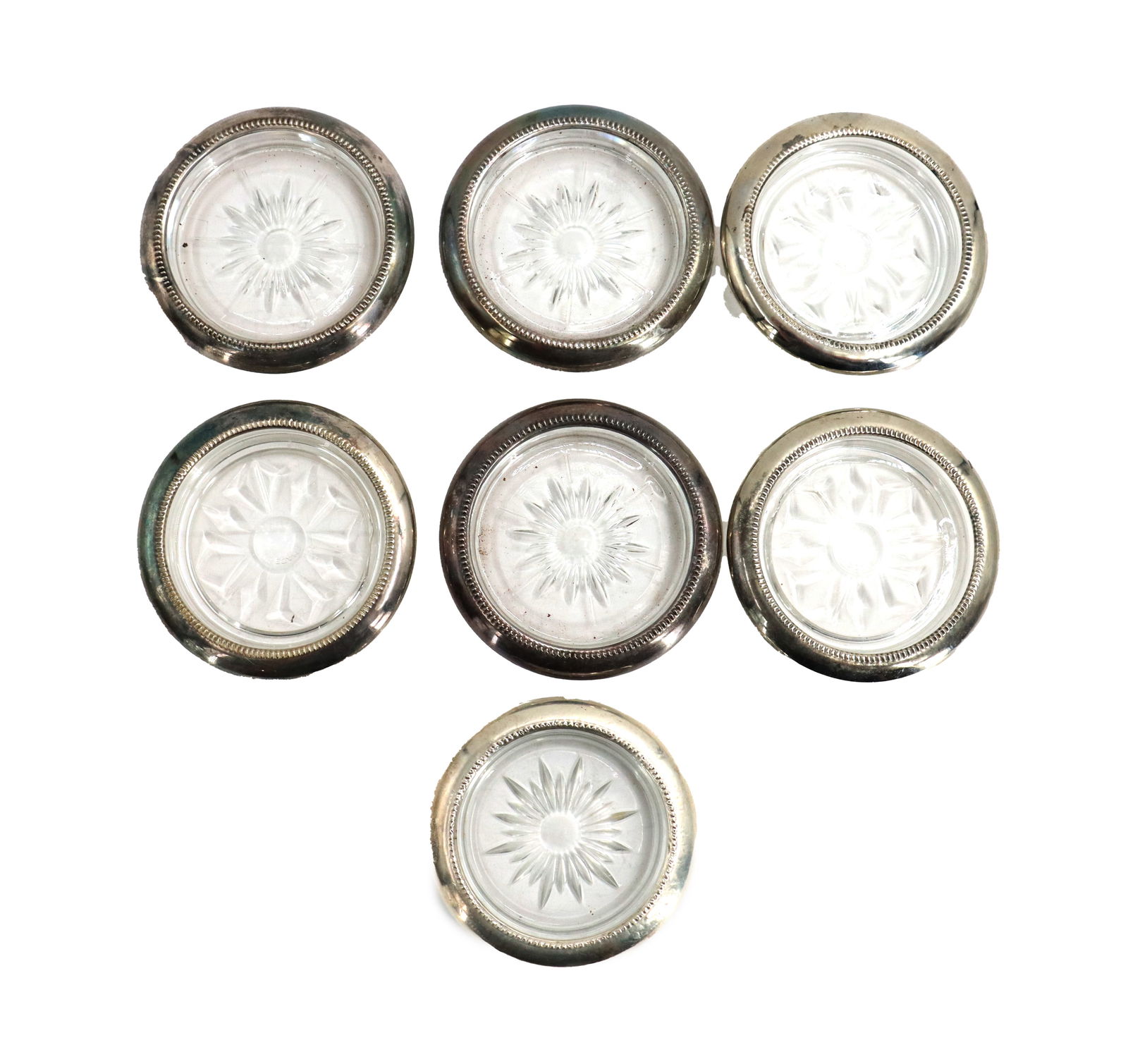 (7) Glass and Silver Vanity Trays: (7) Glass and Silver Vanity Trays. Lot of seven glass and silver vanity trays. Two marked sterling. Size: 3/4 x 4 in.