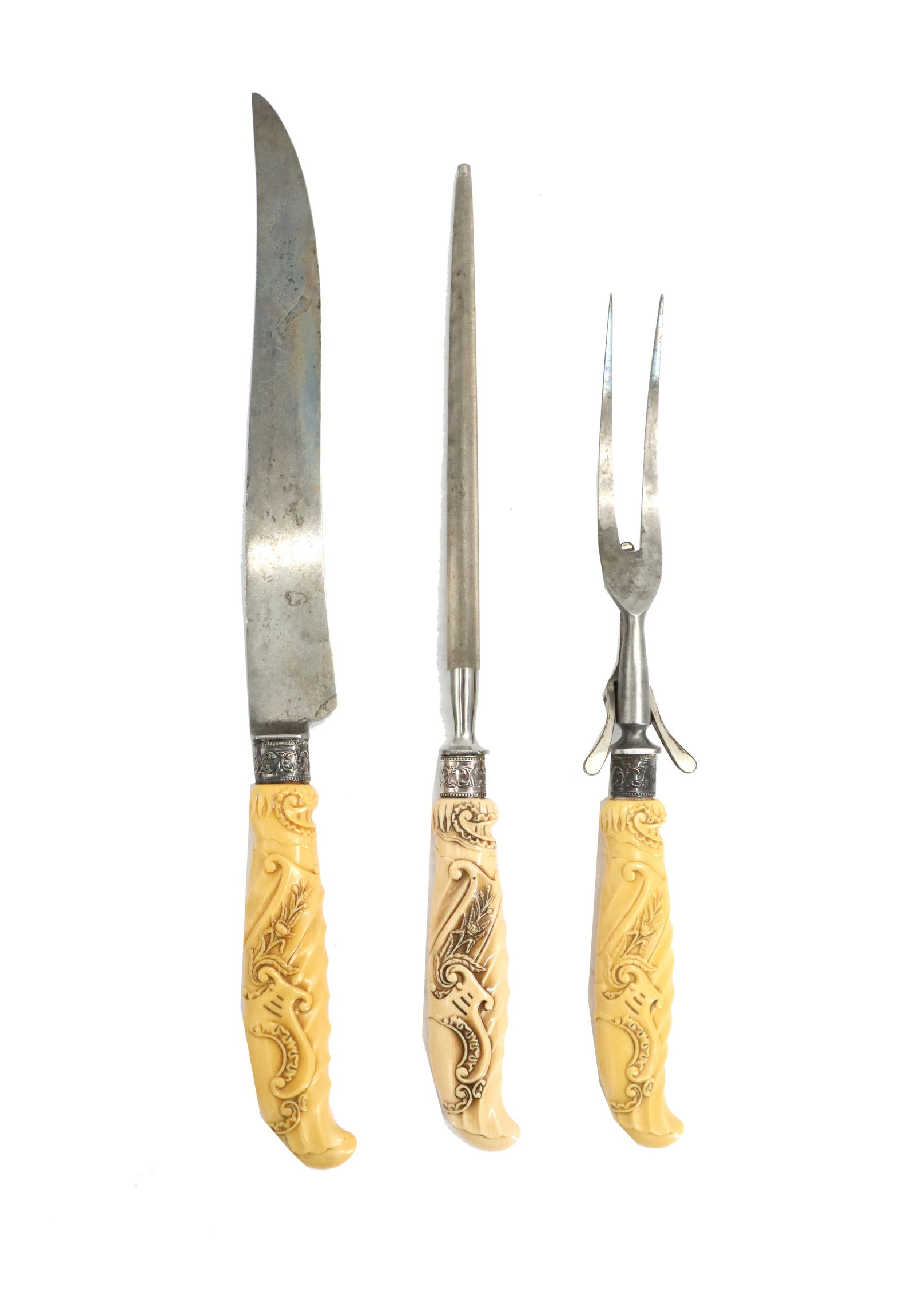 (3) Piece Landers, Frary & Clark Universal Stainless Steel and Celluloid Carving Set: (3) Piece Landers, Frary & Clark Universal Stainless Steel and Celluloid Carving Set. The set is from the early 20th Century, with Irish harp designs all along the celluloid plastic handles and in