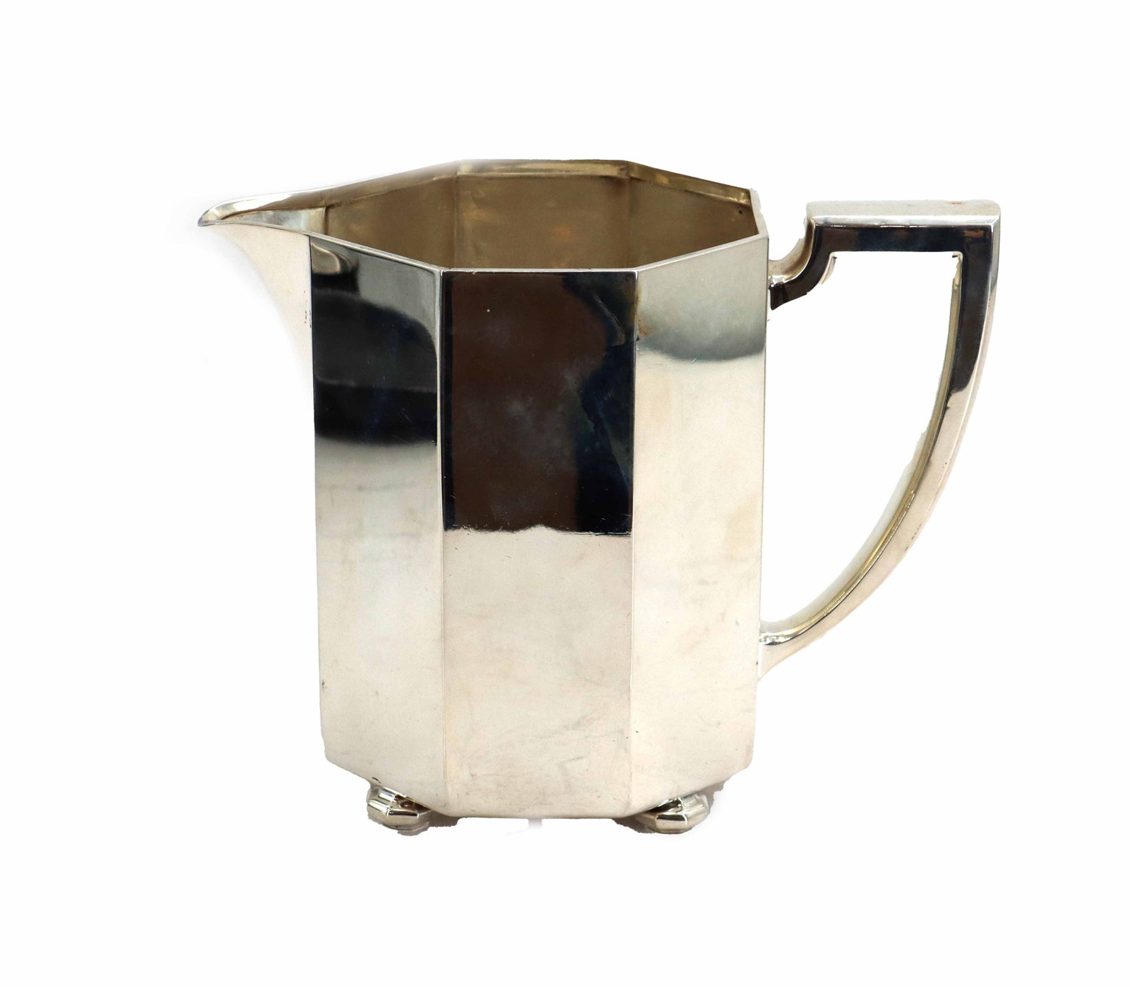 Antique Whiting Manufacturing Sterling Silver Art Deco Pitcher - 21.25 ozt.: Antique Whiting Manufacturing Sterling Silver Art Deco Pitcher - 21.25 ozt. Striking octagonal body shape with angular handle and short spout, as well as four stout feet to keep condensation on the bo