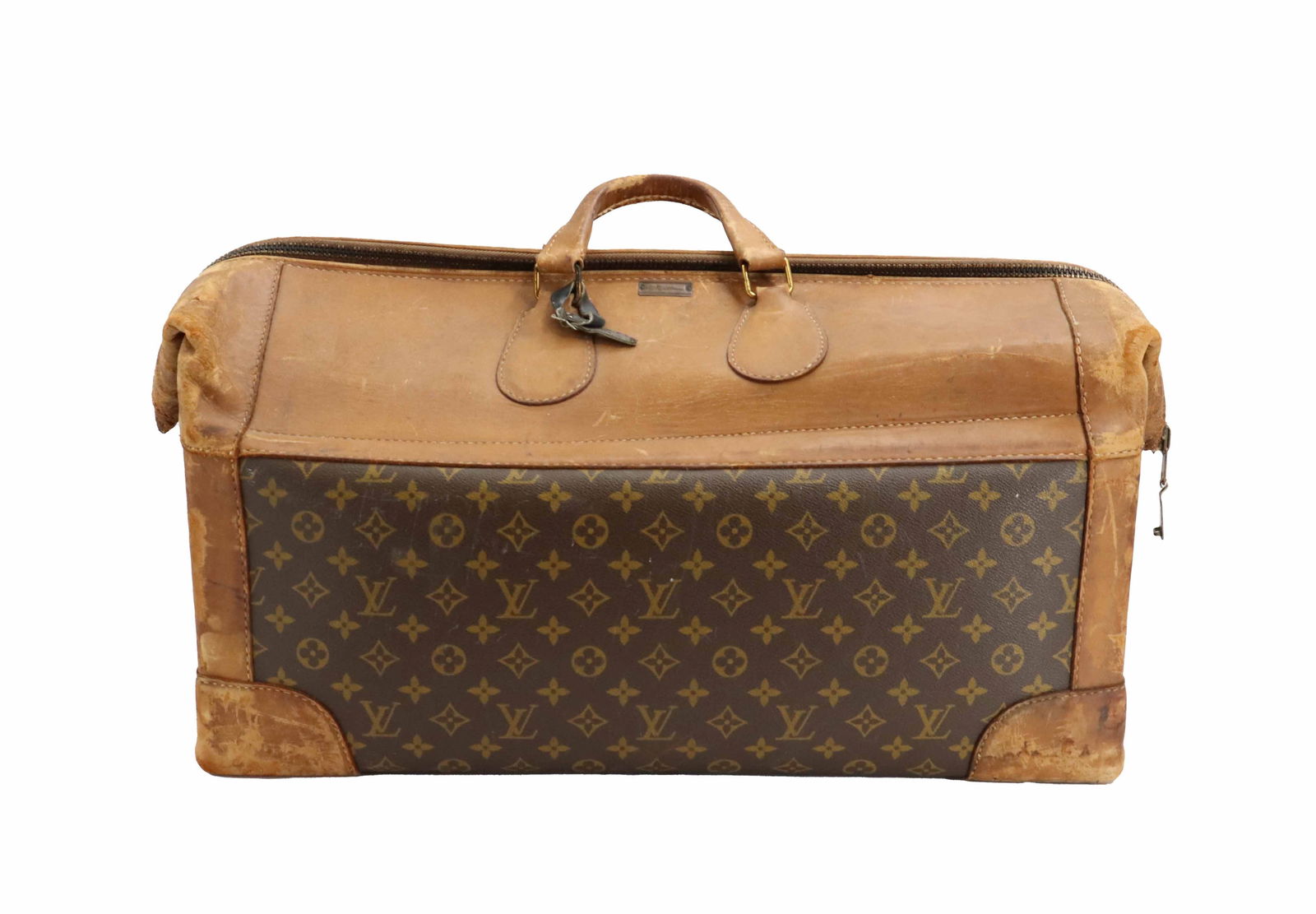 1970's Louis Vuitton Weekender: 1970's Louis Vuitton Weekender. Leather and monogram canvas. Brass hardware. Condition: Staining inside. Wear throughout. Size: 26 x 11 1/2 x 12 in.