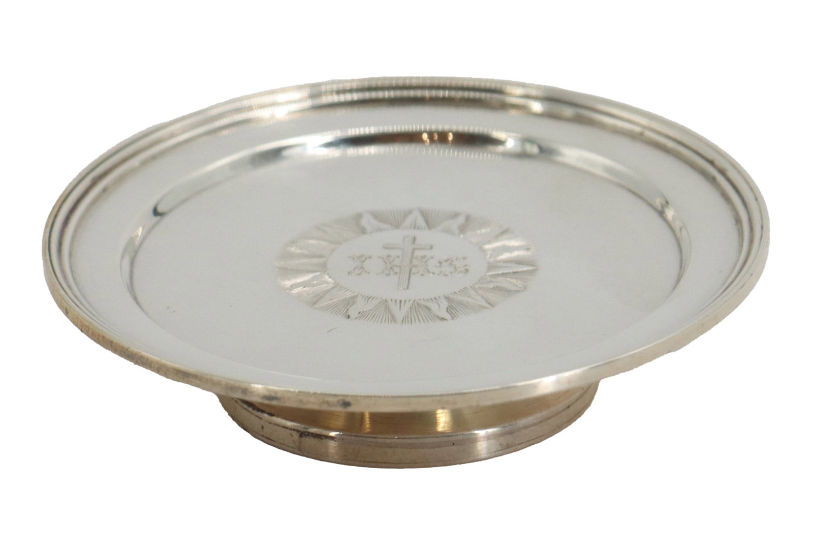 Weighted European Silver - Gross 1.455 ozt.: Weighted European Silver - Gross 1.455 ozt. Small, circular, silver-colored plate or shallow dish set upon a low, recessed base. The center of the plate is decorated with an engraving of a cross