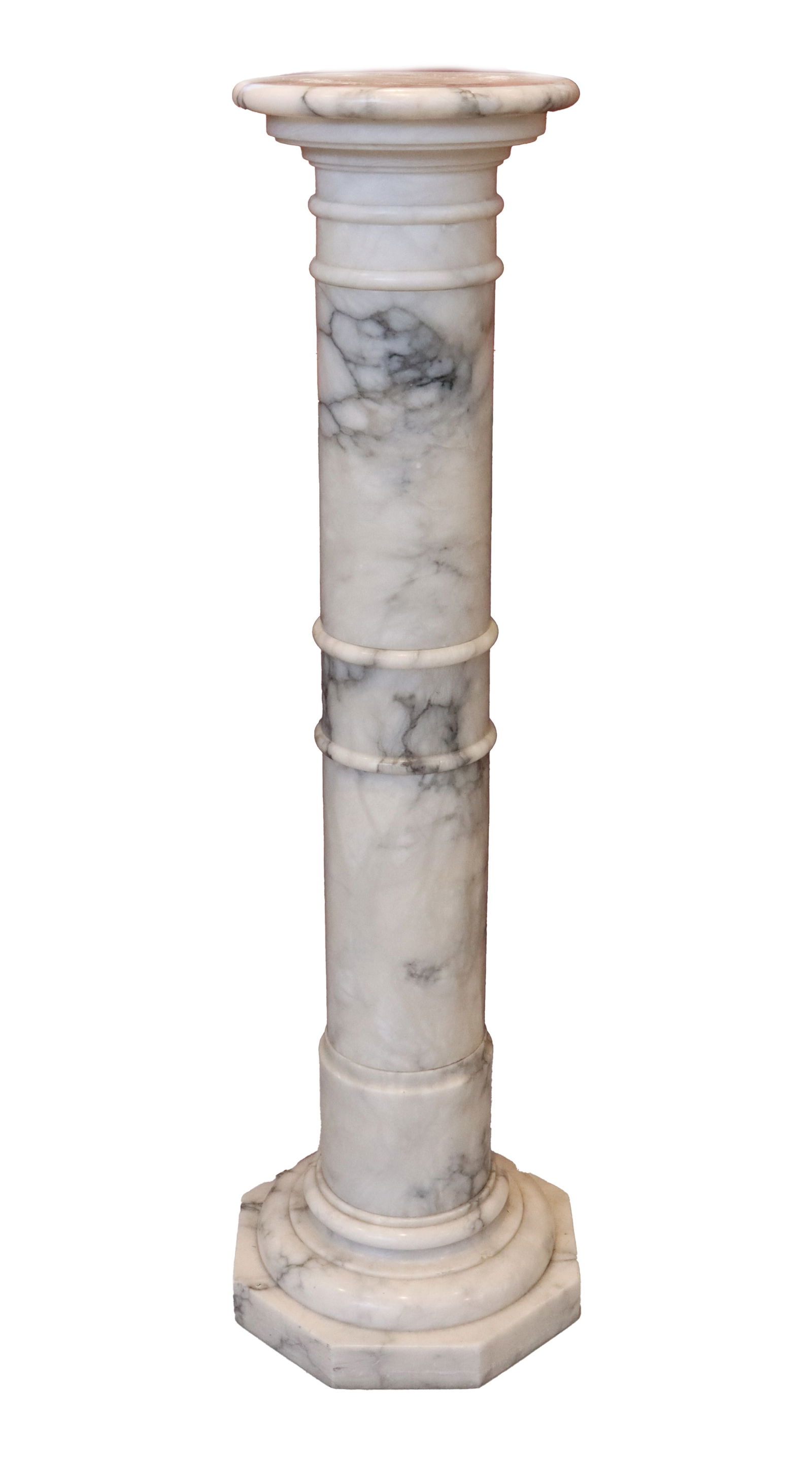 Classically Styled Marble Pedestal: Classically Styled Marble Pedestal. Body is a straight, cylindrical column. The shaft is divided into sections by decorative, slightly raised, thick rings or annulets. The top features a sim