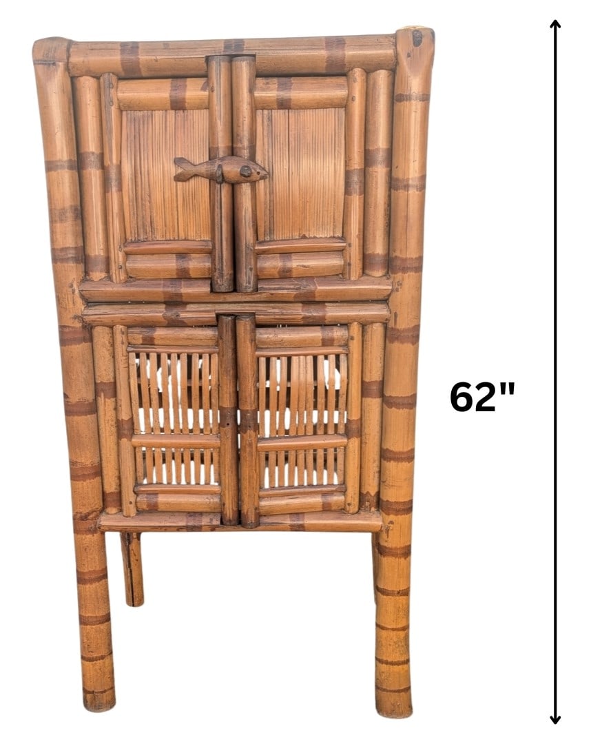 Vintage Asian Style Bamboo 2 Compartment Cabinet: Vintage Asian Style Bamboo 2 Compartment Cabinet. Top section is secured by solid doors with a unique fish-shaped wooden latch. Lower section features decorative slatted doors. Elevated on four sturdy